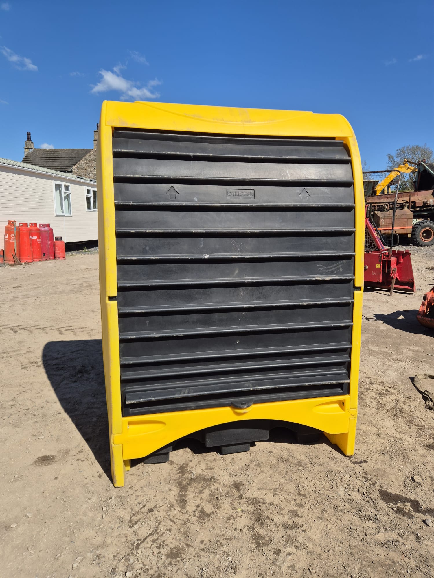 2-DRUM HARDCOVER SPILL PALLET USED FOR STORING HAZARDOUS MATERIALS.